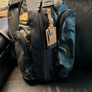 TUMI sling bag. Never used.